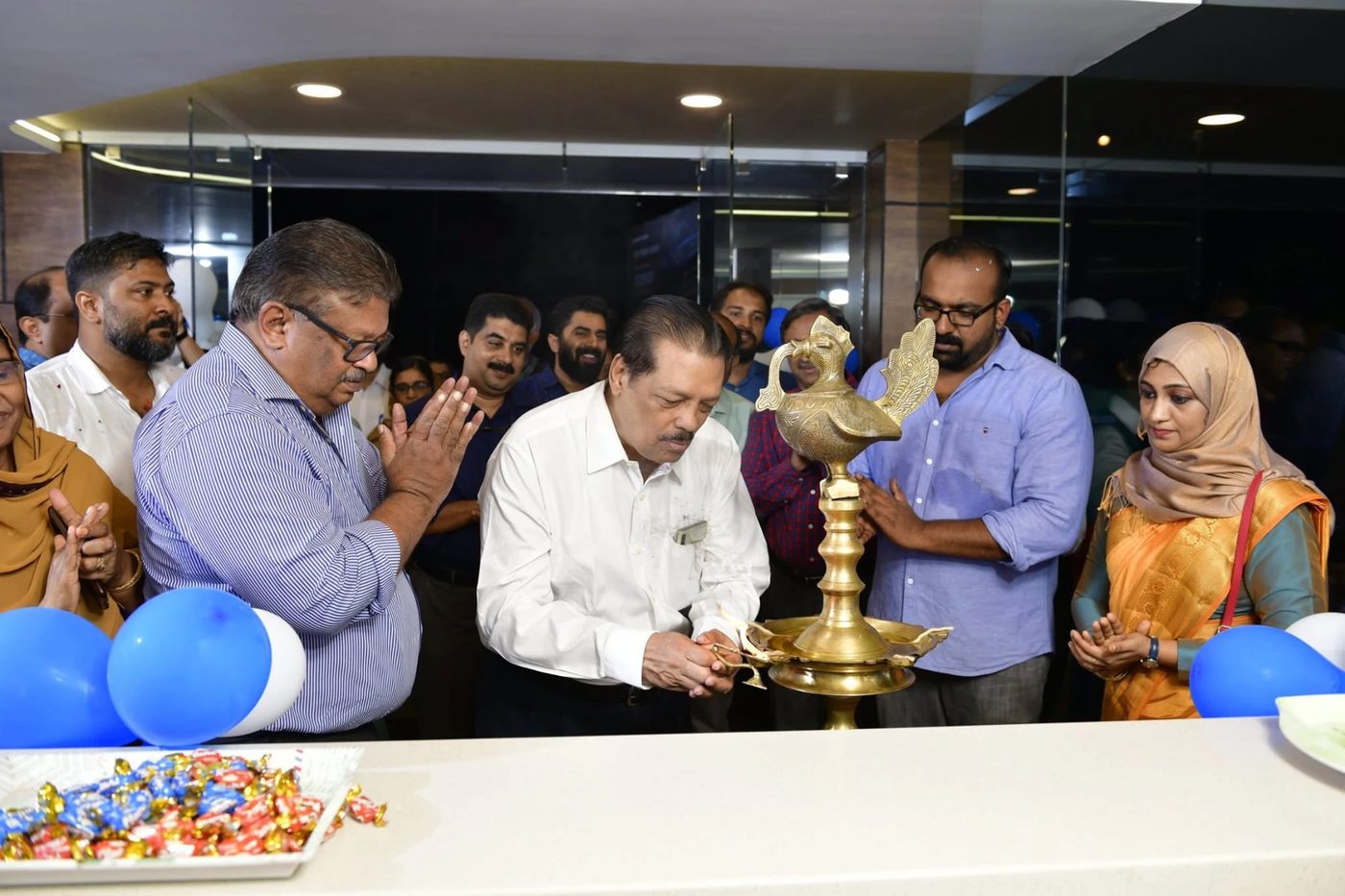 Lighting the traditional lamp at a Futureace opening ceremony
